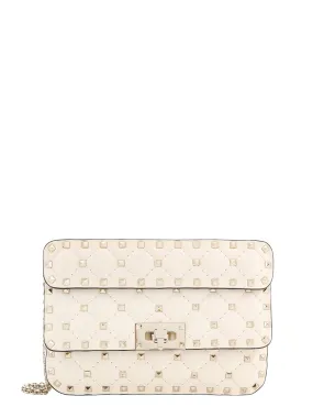 Leather shoulder bag with iconic studs